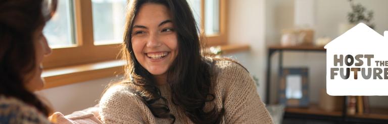 A young girl speaking to her Homestays host